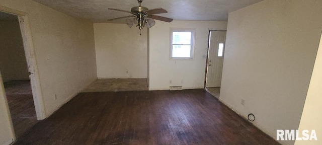 empty room featuring dark hardwood / wood-style floors and ceiling fan