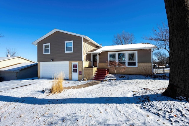 split level home with a garage