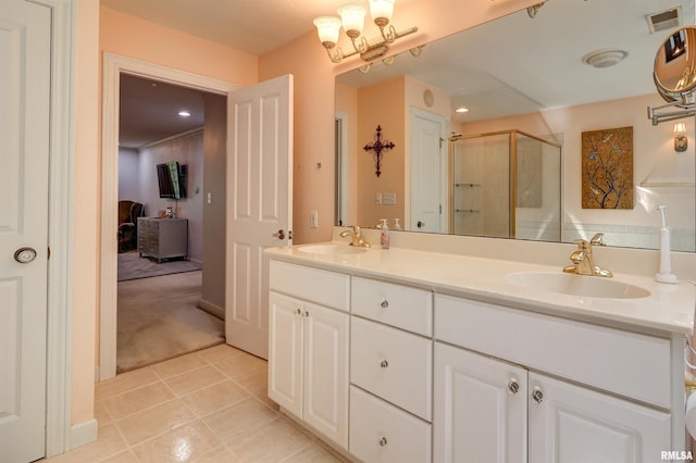 bathroom with vanity, tile patterned floors, and walk in shower