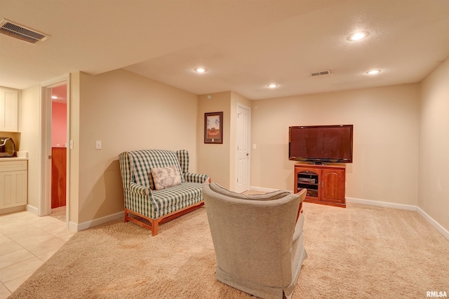 living room featuring light carpet