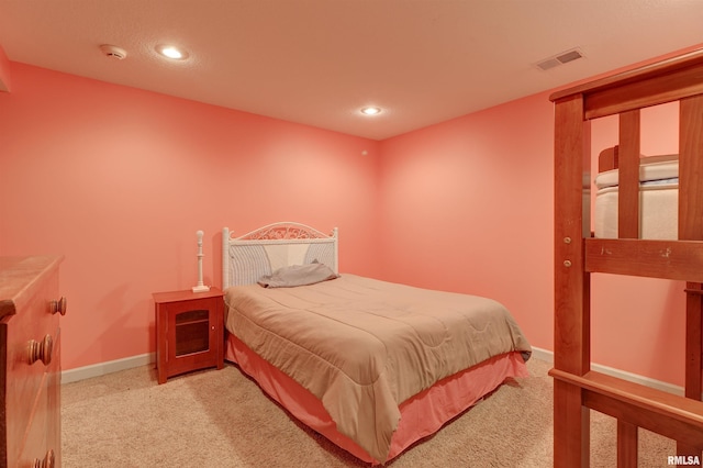 bedroom with light carpet