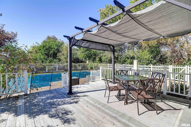 wooden terrace featuring a pergola and a covered pool