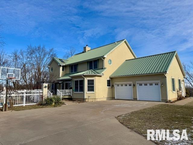 exterior space with a garage and covered porch