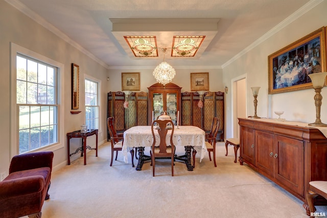 carpeted dining space featuring ornamental molding and a chandelier