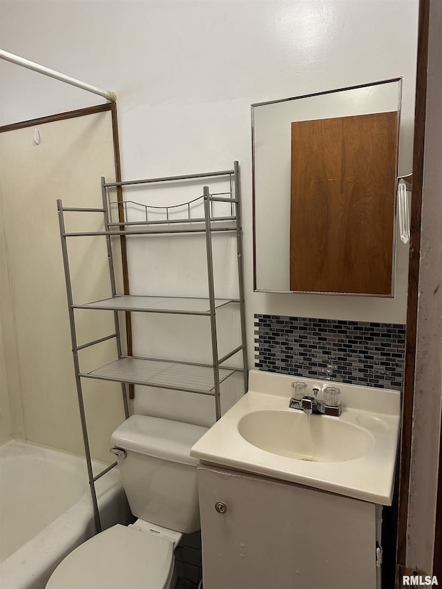 full bathroom featuring vanity, decorative backsplash, tub / shower combination, and toilet