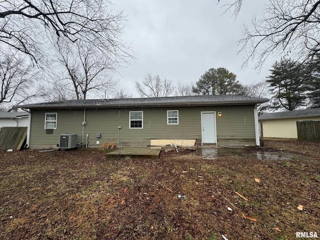 rear view of property featuring cooling unit and a patio area