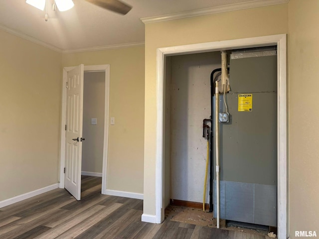 unfurnished bedroom featuring baseboards, a closet, ornamental molding, and wood finished floors