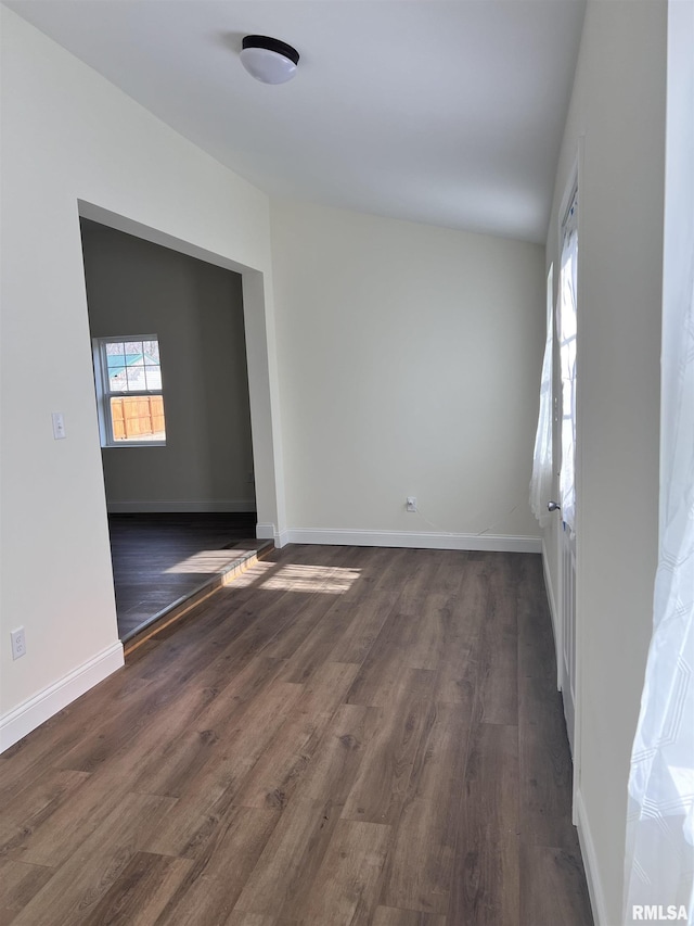 spare room featuring dark hardwood / wood-style floors