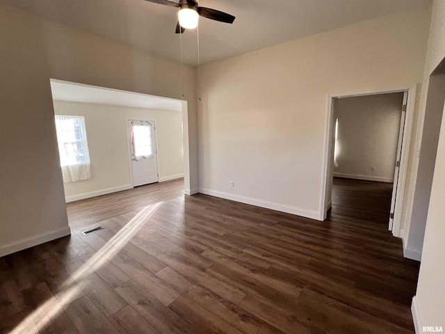 interior space featuring ceiling fan and dark hardwood / wood-style flooring