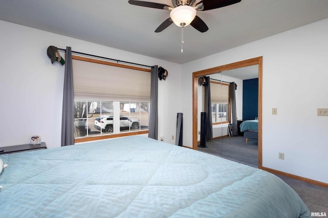 bedroom featuring ceiling fan, a closet, and carpet