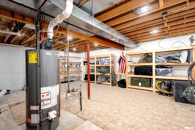 basement with brick wall and gas water heater