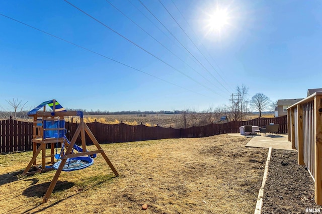 view of yard with a playground and a patio area