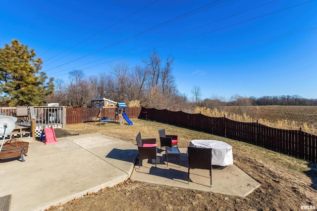 view of yard with a patio and a playground