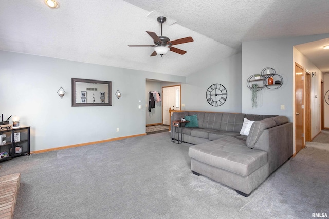 living room featuring lofted ceiling, a textured ceiling, carpet floors, and ceiling fan