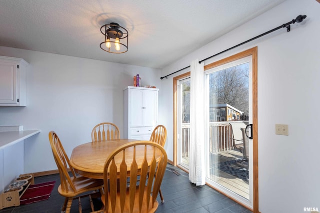 dining room with a textured ceiling