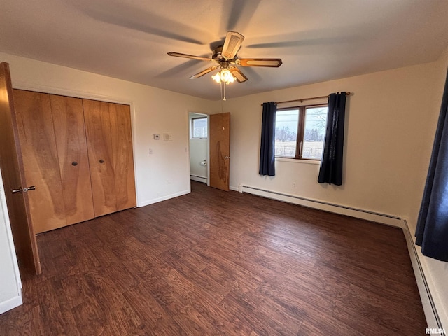 unfurnished bedroom with a closet, dark hardwood / wood-style floors, ceiling fan, and baseboard heating