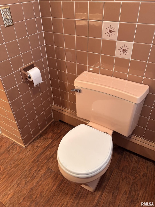 bathroom featuring wood-type flooring and toilet