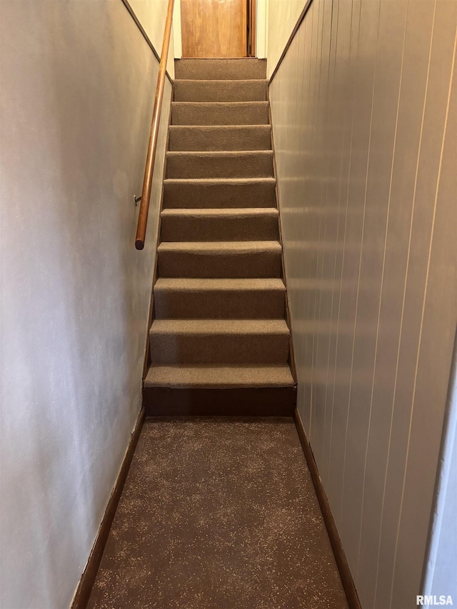 stairway with wooden walls