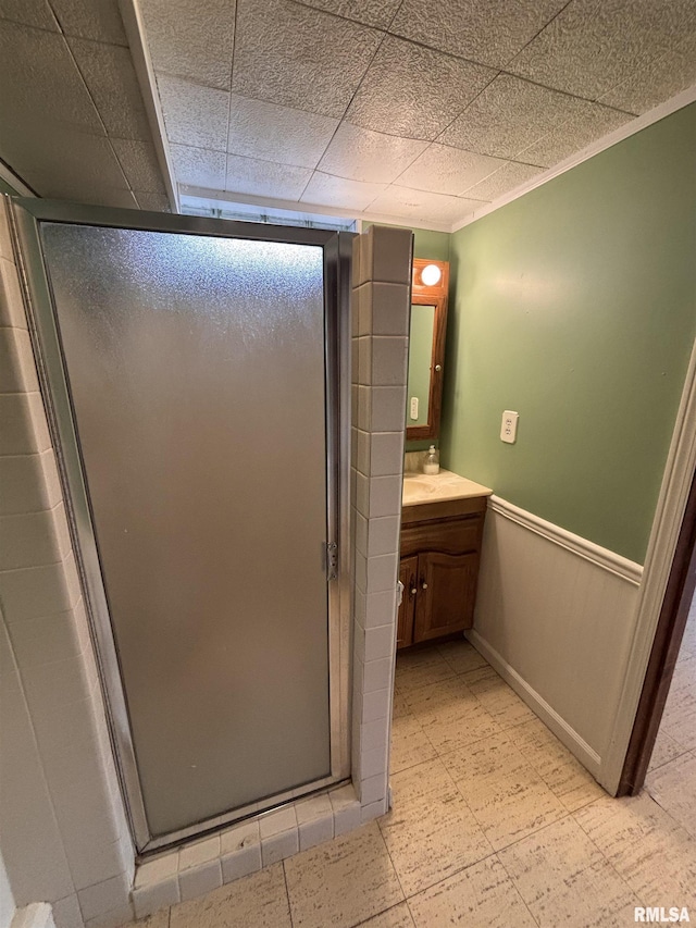 bathroom featuring an enclosed shower and vanity