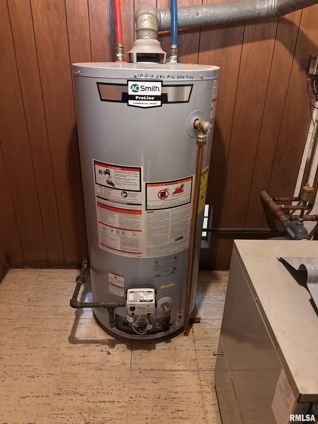 utility room with gas water heater