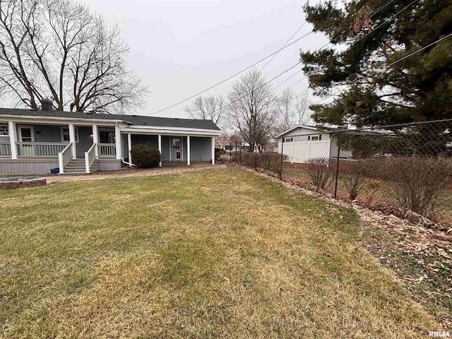 view of yard with covered porch