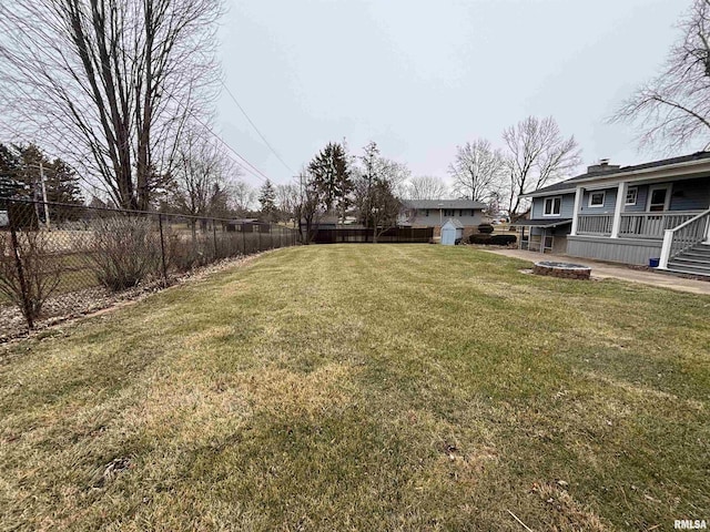 view of yard with an outdoor fire pit