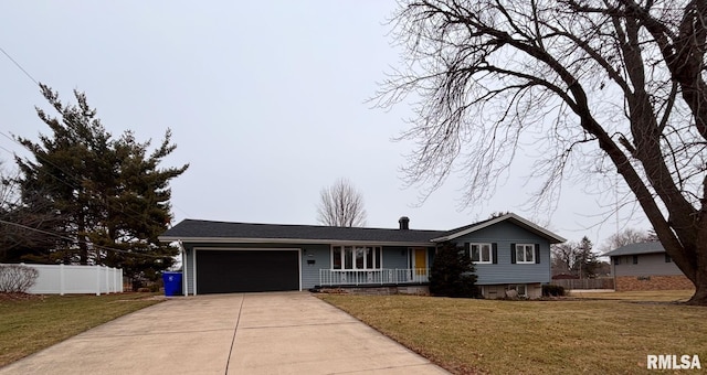 ranch-style home featuring a garage and a front yard