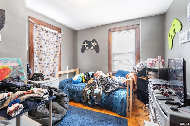 bedroom featuring wood-type flooring