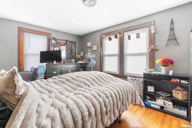 bedroom with light hardwood / wood-style floors