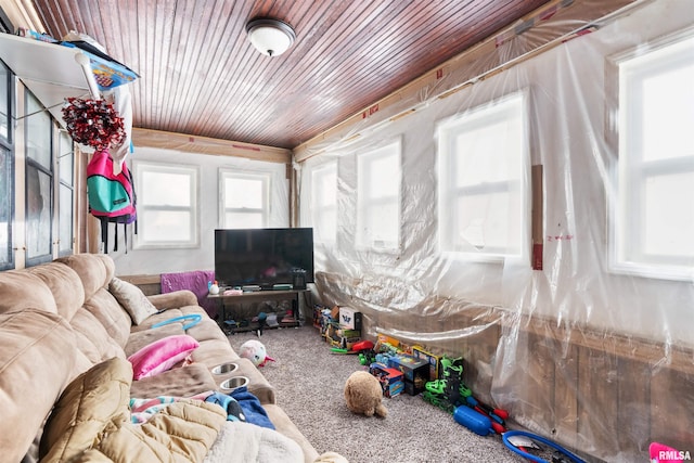 living room with wood ceiling and carpet flooring