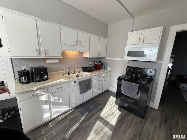 kitchen with sink, white cabinetry, black range with electric stovetop, dark hardwood / wood-style floors, and tasteful backsplash