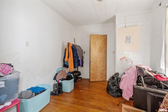 interior space with crown molding and hardwood / wood-style floors