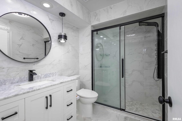 bathroom featuring vanity, toilet, tile walls, and walk in shower