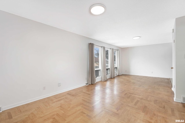 empty room with light parquet floors