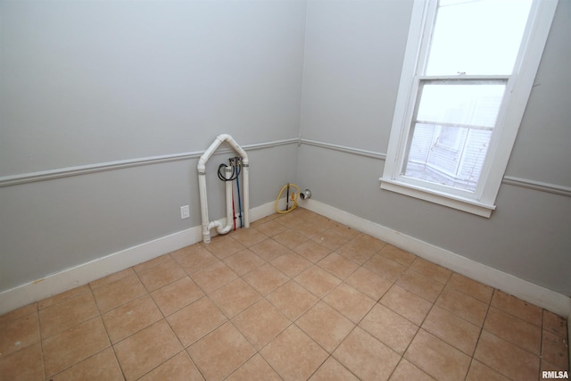 laundry room with light tile patterned floors