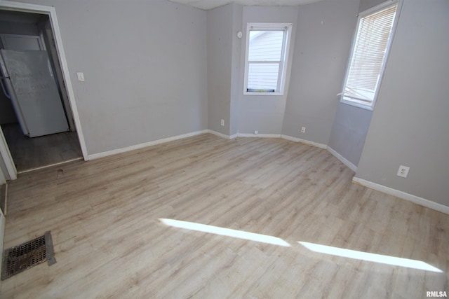 empty room with light wood-type flooring