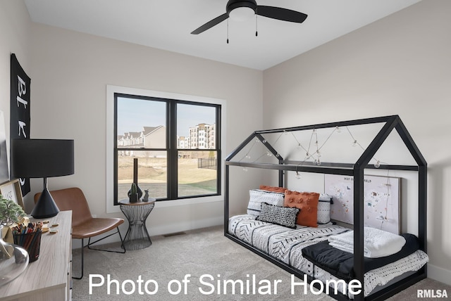 carpeted bedroom featuring ceiling fan