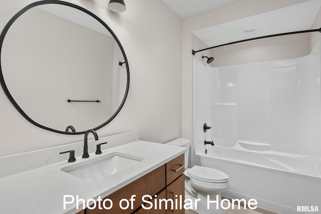 full bathroom featuring shower / washtub combination, vanity, and toilet