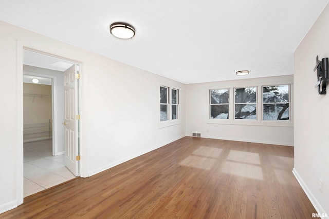 unfurnished room with light hardwood / wood-style flooring