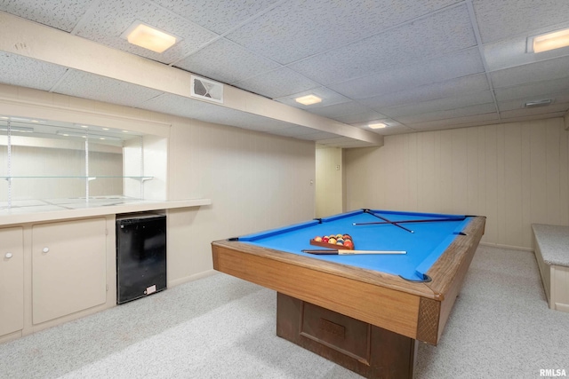 recreation room with wine cooler, a paneled ceiling, pool table, and light carpet