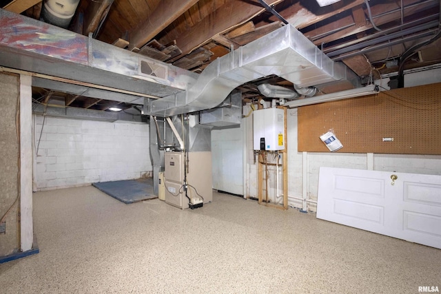 basement featuring heating unit and tankless water heater