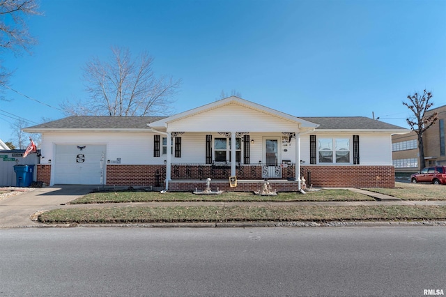 ranch-style house with a garage, a porch, and a front lawn