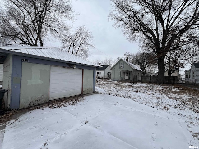 view of snow covered garage