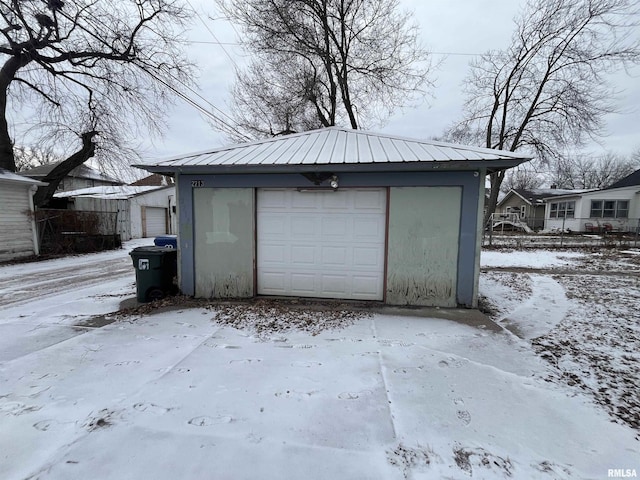 view of snow covered garage