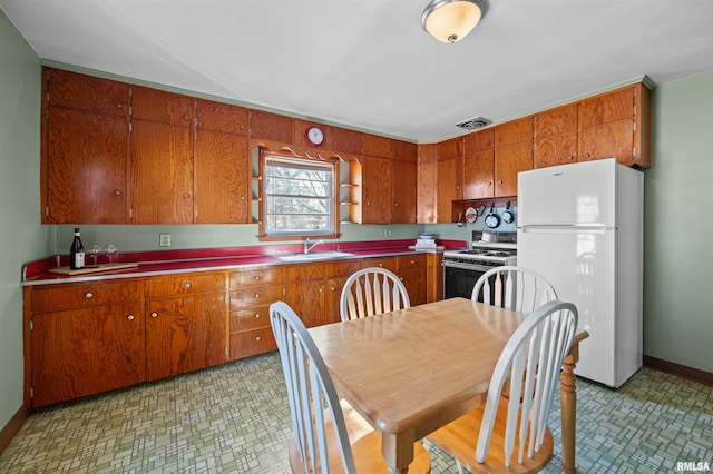 kitchen with sink and white appliances