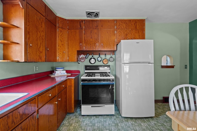 kitchen with white appliances and sink