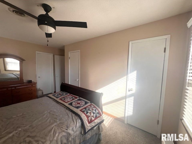 unfurnished bedroom with carpet floors and ceiling fan