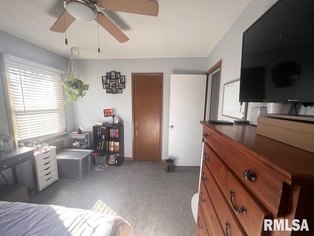 bedroom featuring light colored carpet and ceiling fan