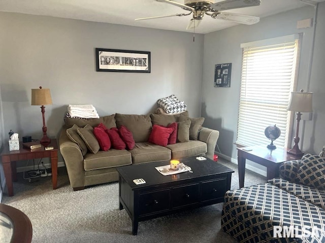 living room featuring ceiling fan and carpet