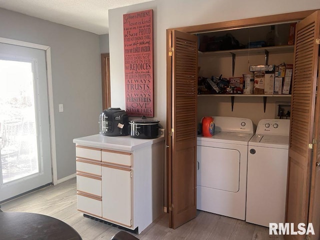 laundry room featuring independent washer and dryer and a wealth of natural light